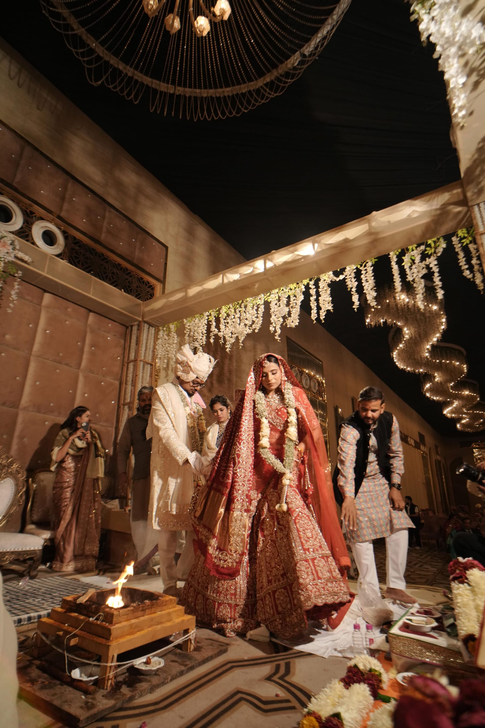 Bride and groom at the sacred fire during a Hindu wedding ceremony